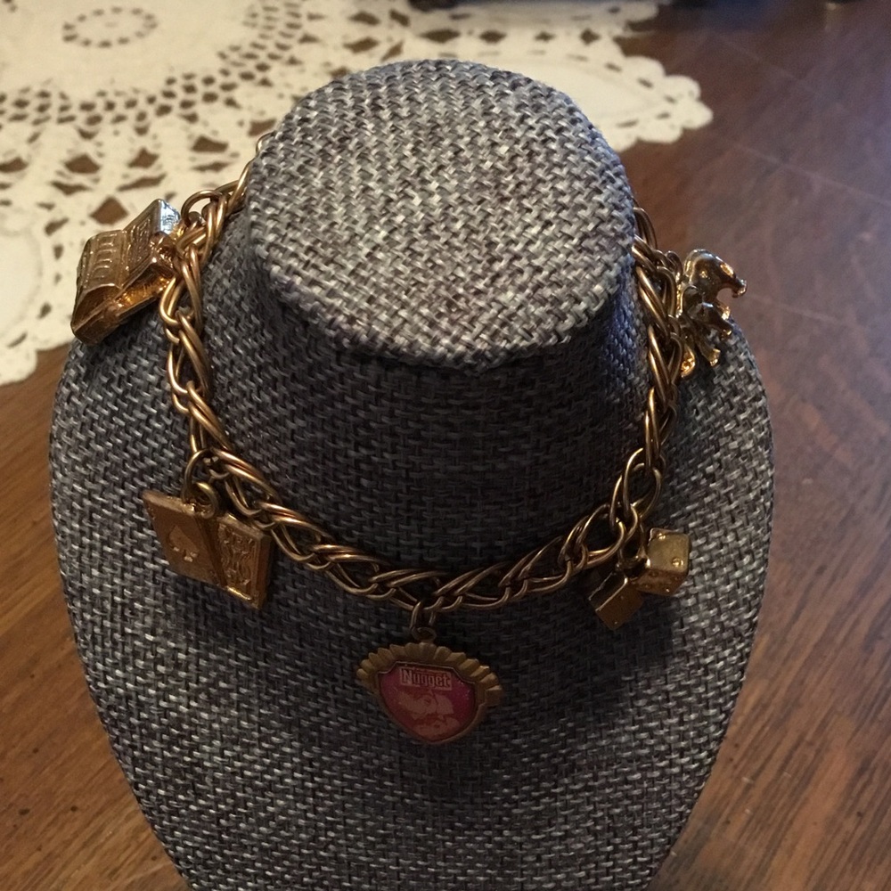 Gold tone bracelet with charms